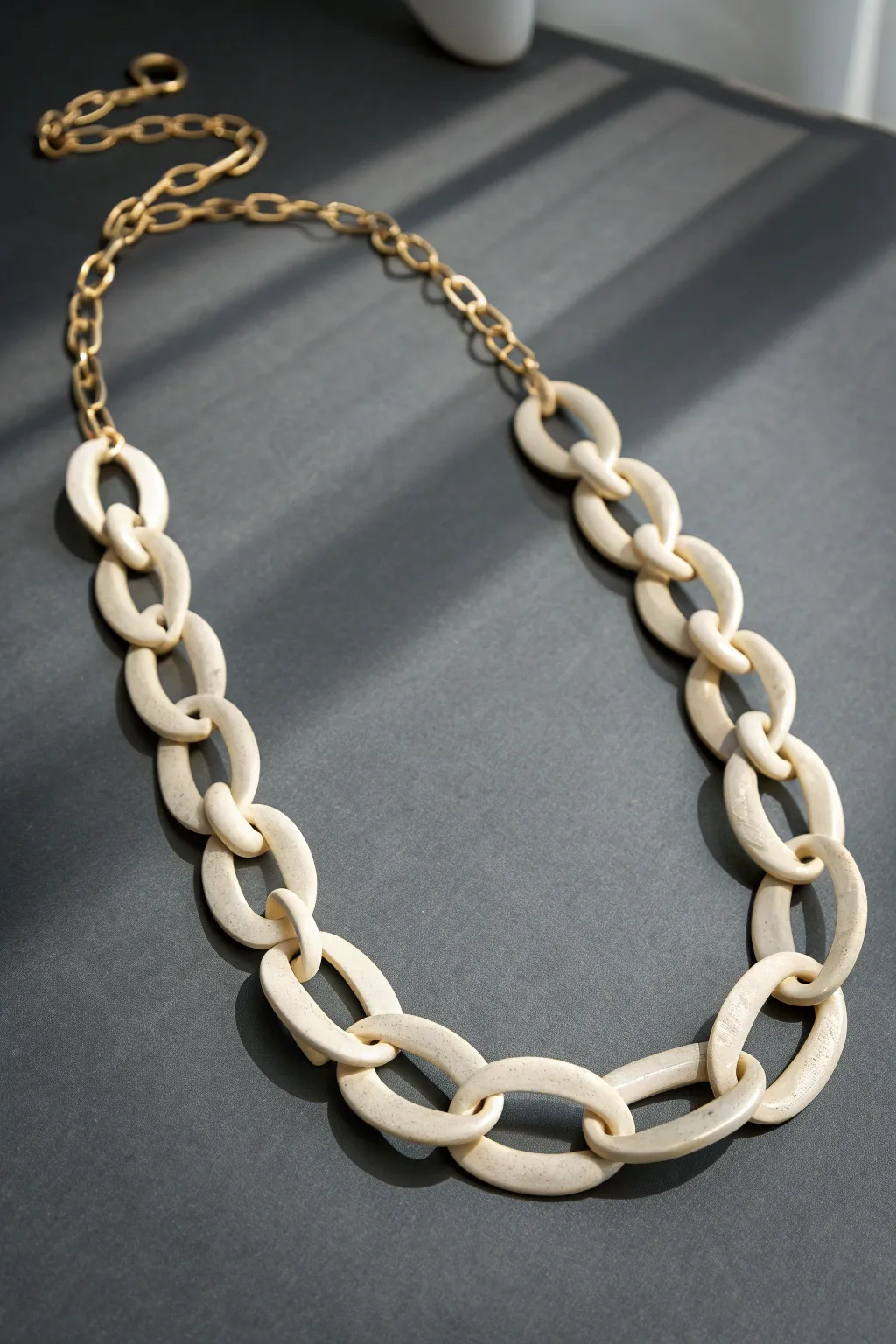 Sculptural hollow link clay necklace in satin ivory, bold yet airy, minimalist boho statement.