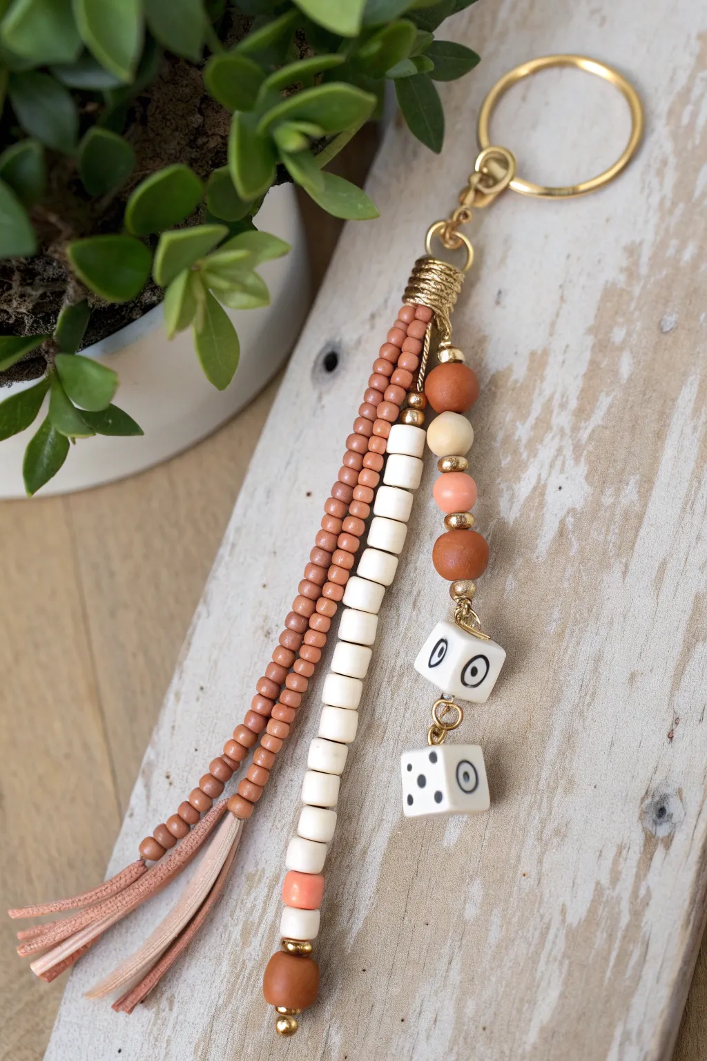 Boho messy stack keychain in soft neutrals with heishi beads, alphabet cubes, and a tiny clay charm
