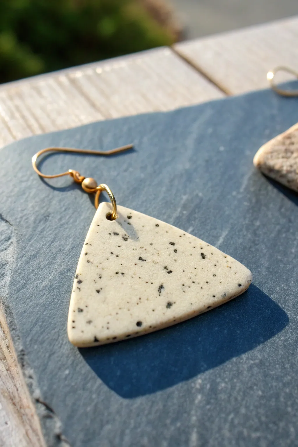 Granite-inspired clay earring with soft speckles on cool slate for a clean Nordic mood.