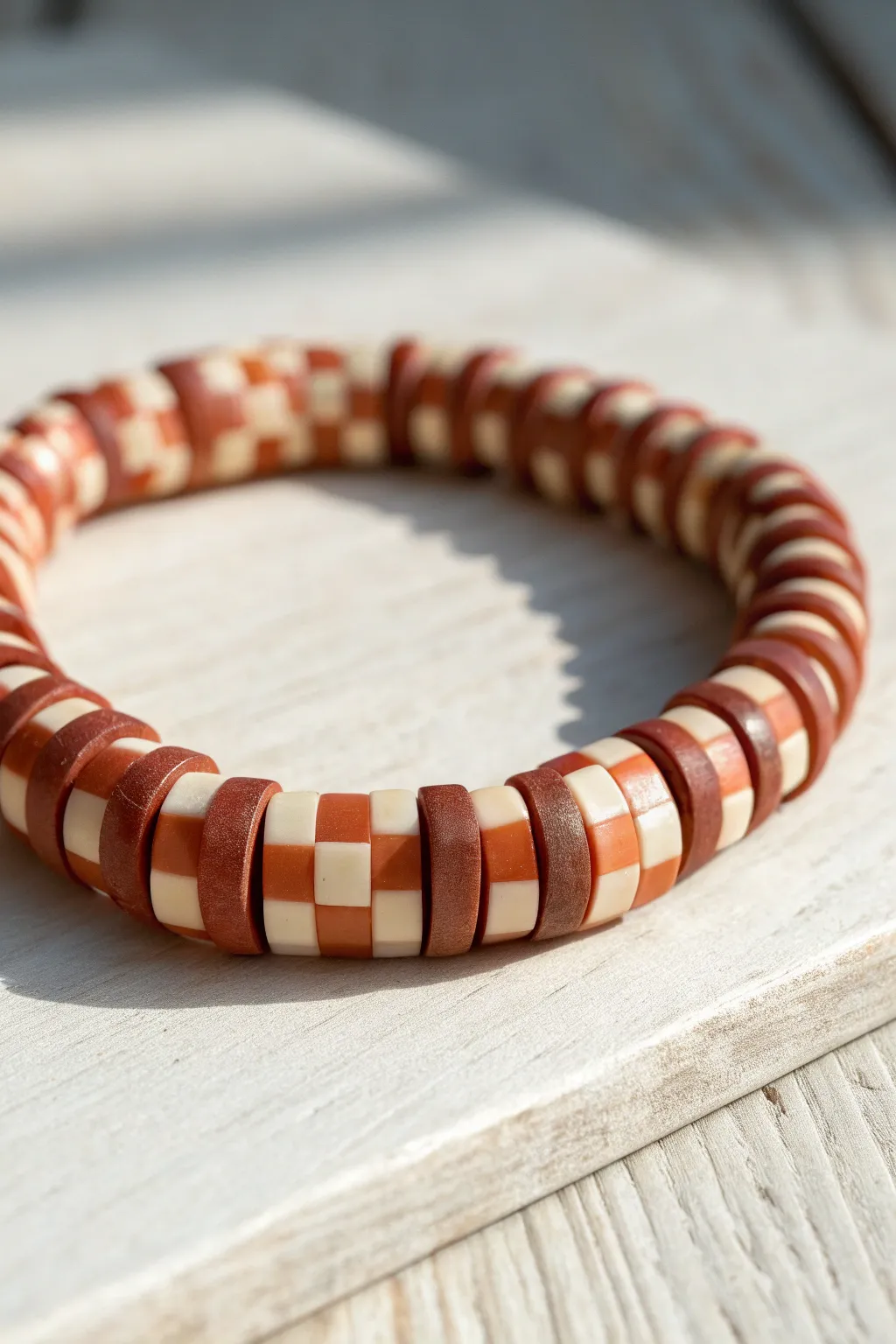 Two-tone clay disc bead bracelet with an AABBAABB checkerboard flip for modern boho minimalism.