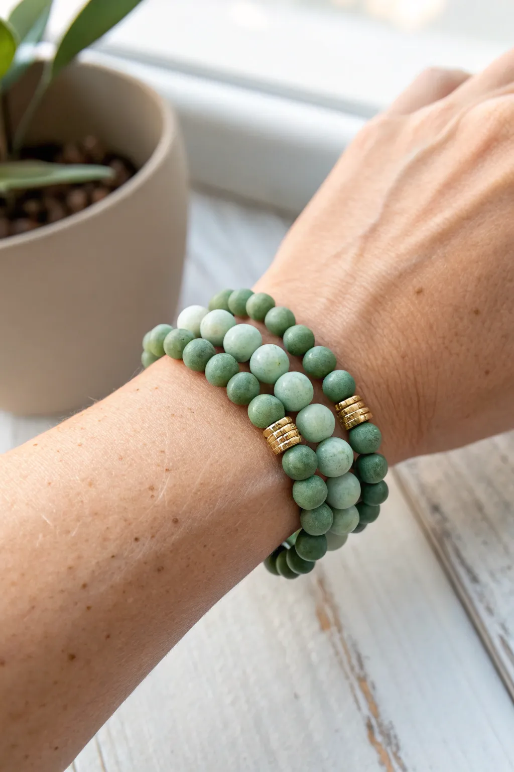 Stacked mint, sage, and forest clay bead bracelets for a calm minimalist boho wrist stack.
