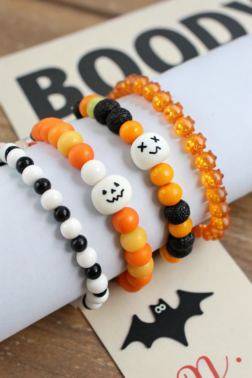 Five mismatched clay Halloween bracelets, perfect for trading, in spooky tones and minimalist style.