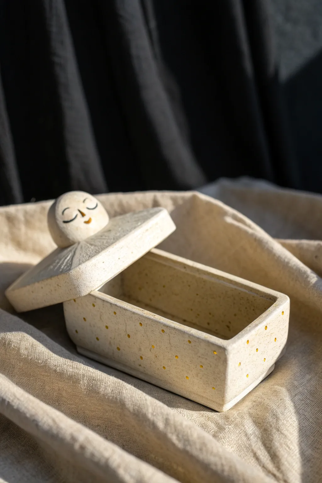 Mini coffin trinket box with a sweet face, slightly open for stashing rings and charms.