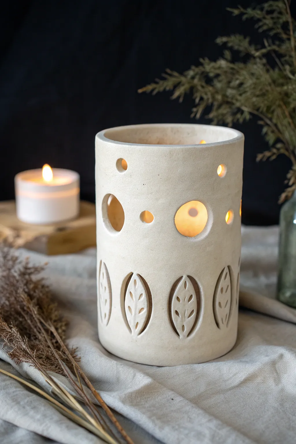 Minimal slab luminary with simple cutouts, glowing warmly against a dark, cozy backdrop