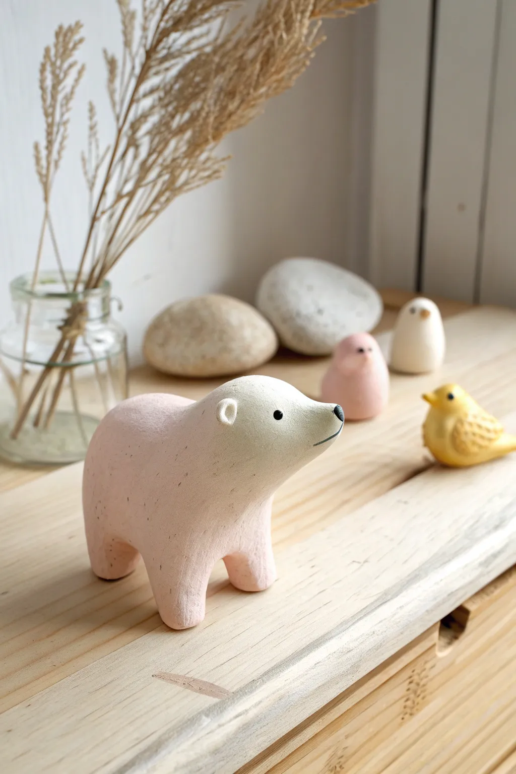 Sweet tiny air dry clay animal figurines in pastel tones, styled on light wood for calm decor.