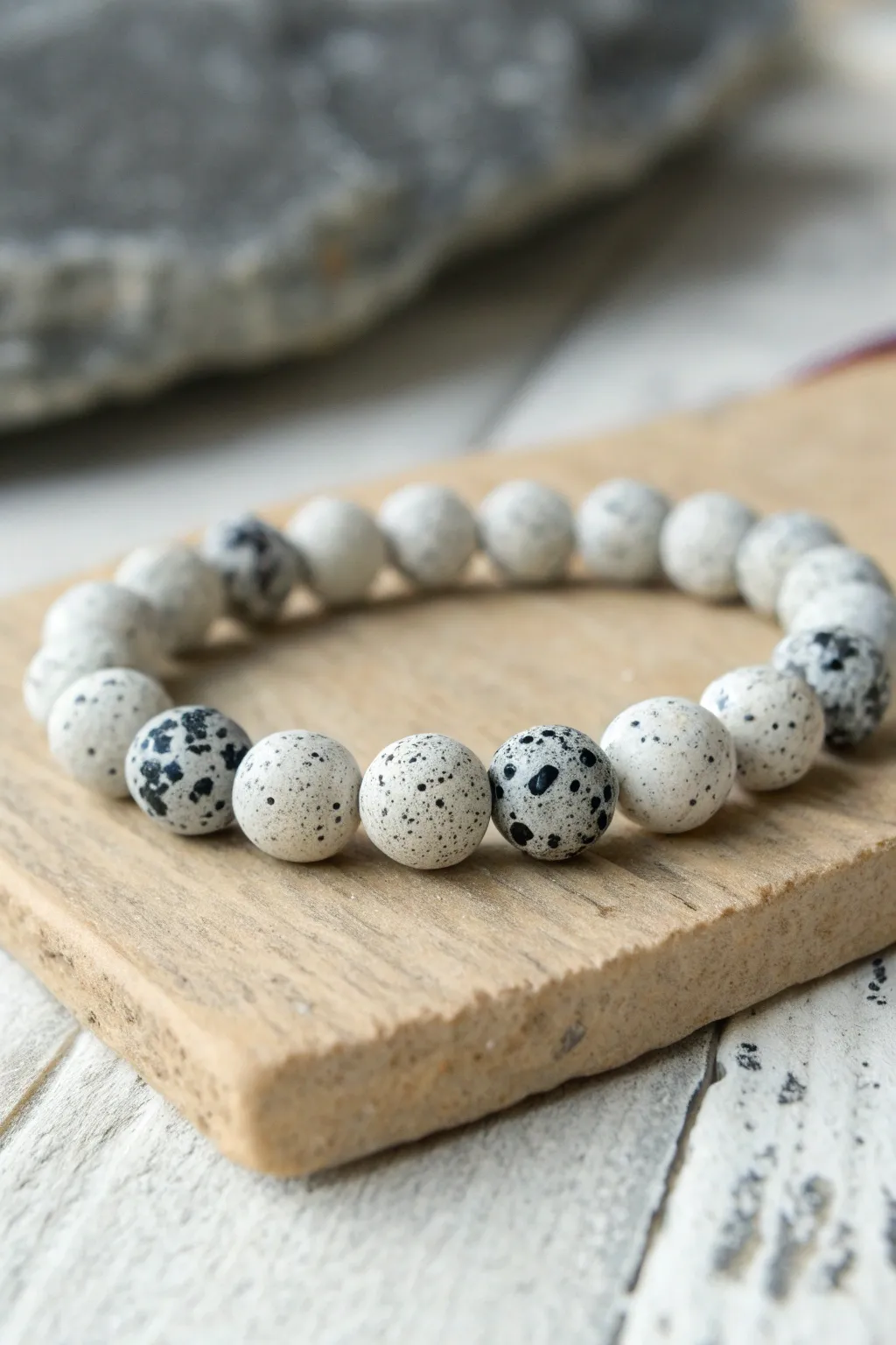 Granite inspired speckled clay bead bracelet styled on natural stone for a clean modern look