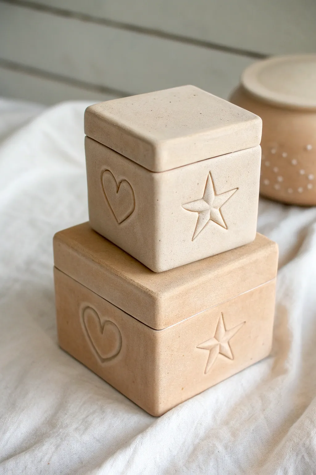 Sweet nesting clay keepsake boxes, heart and star lids, made to stack and stay together.