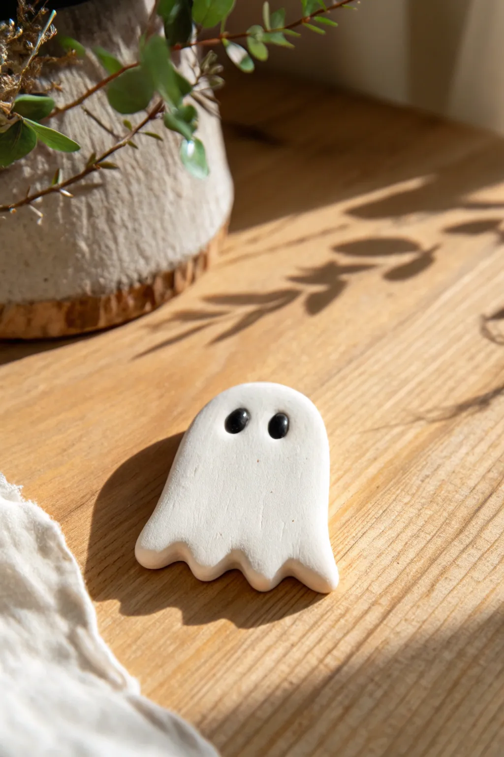 Tiny ghost sheet magnet in oven-bake clay, minimal and charming for a cozy seasonal swap.