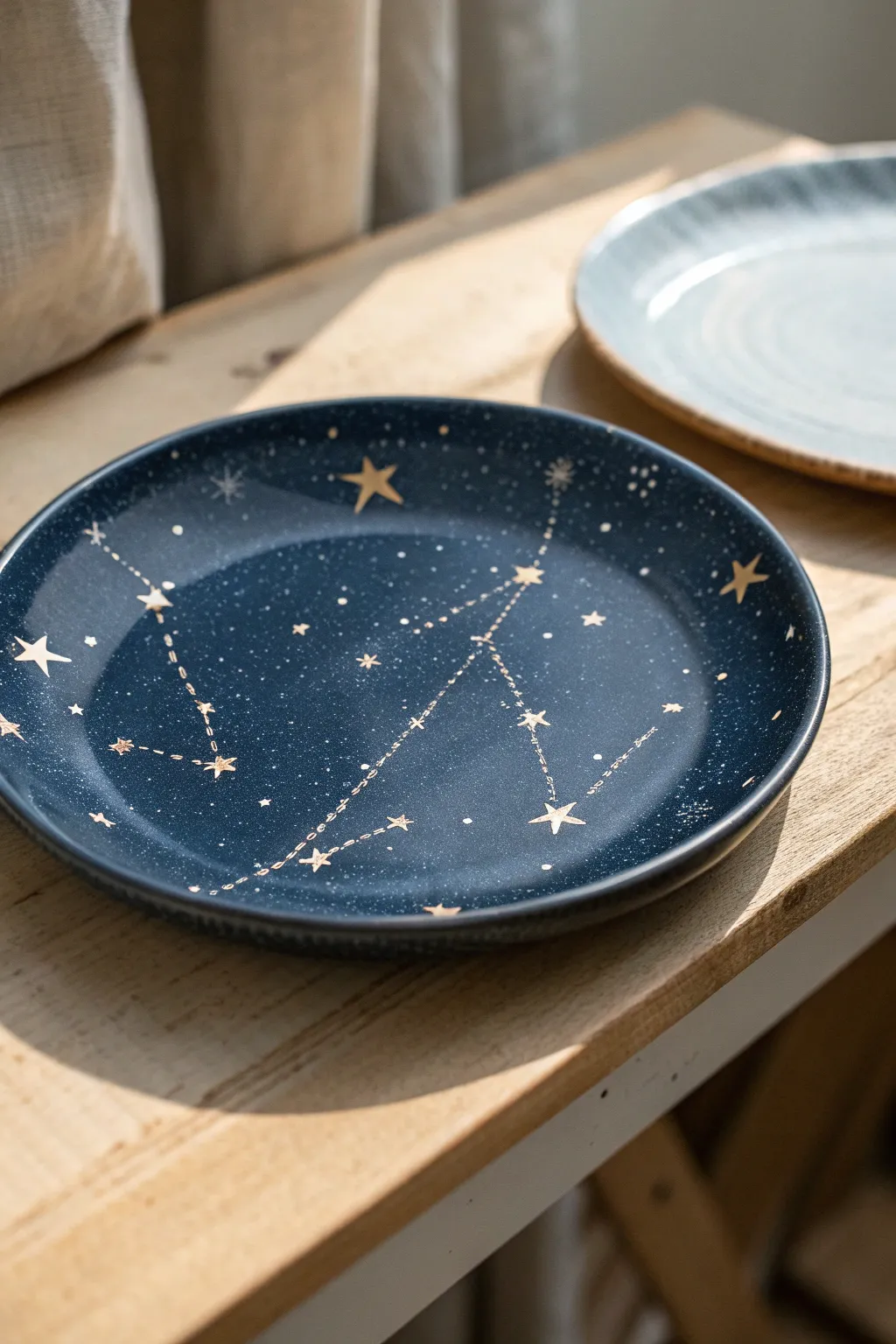 Minimal night-sky plate with wax-resist stars and simple constellations in crisp contrast.