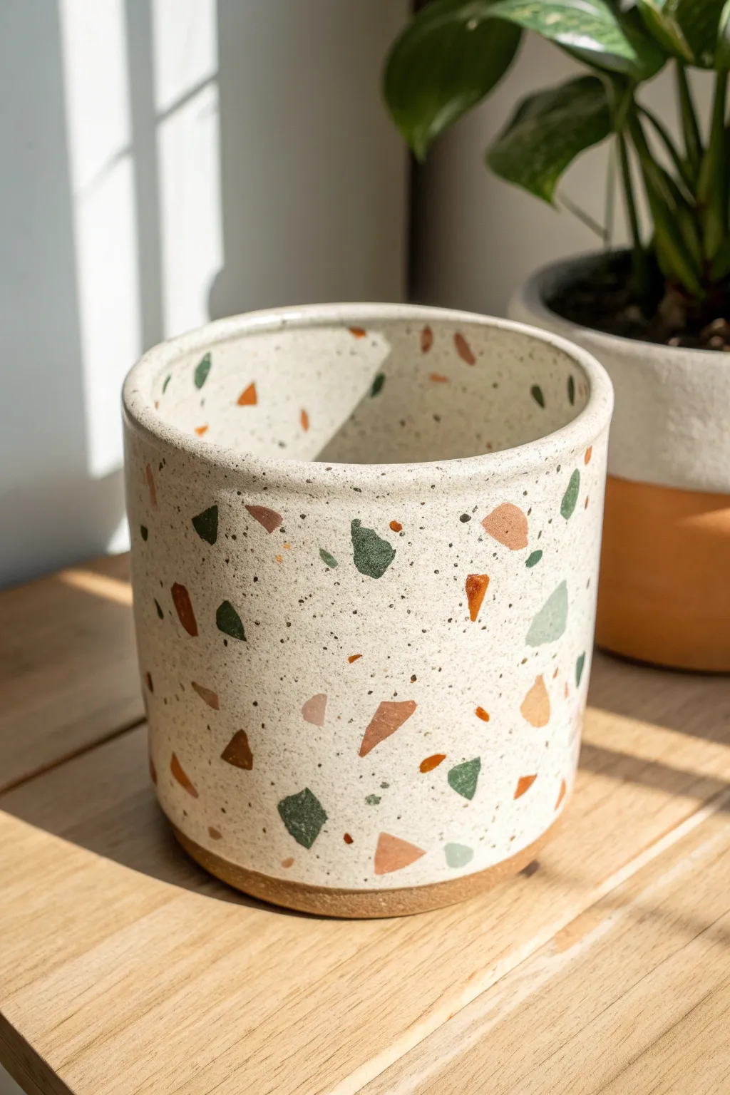 Terrazzo speckles add a playful, modern twist to a simple handmade ceramic planter.