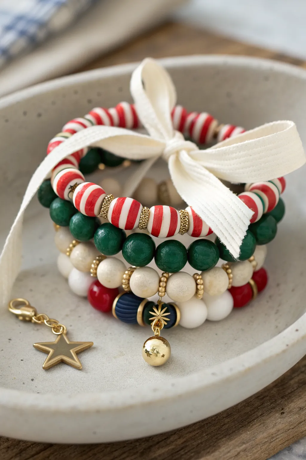 Gift-ready preppy Christmas bracelet stack in matching sets, tied with linen for easy gifting