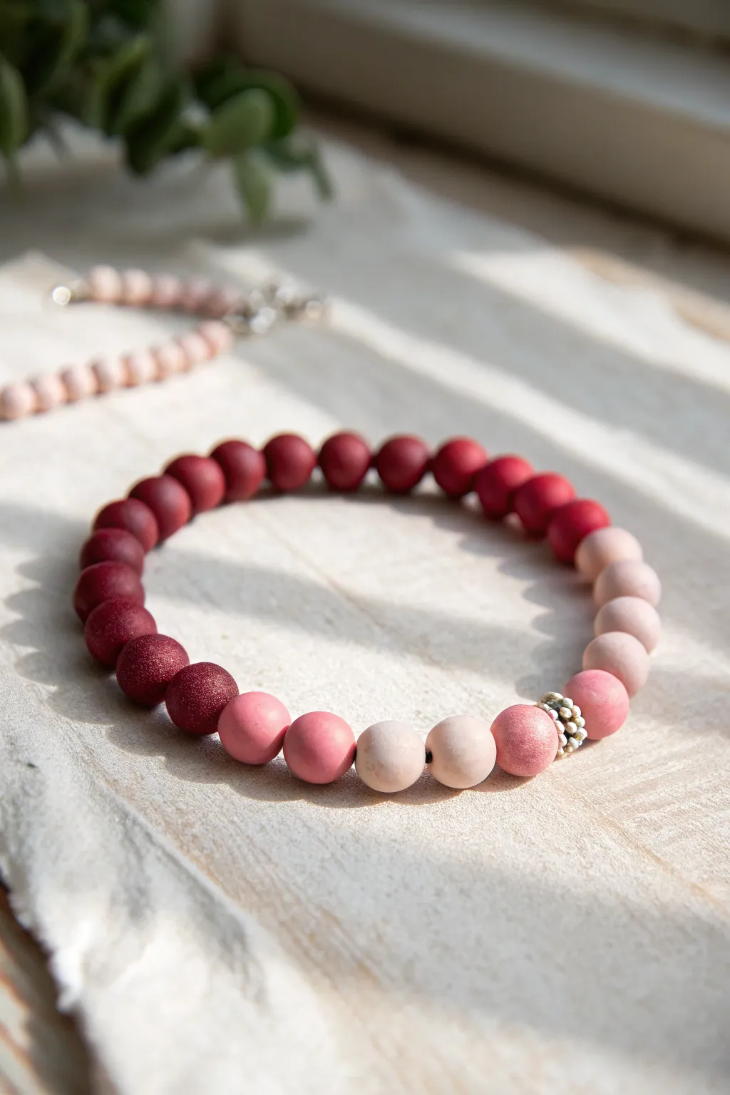Half red, half pink clay bracelet with a tiny heart bead, minimalist Valentine charm.