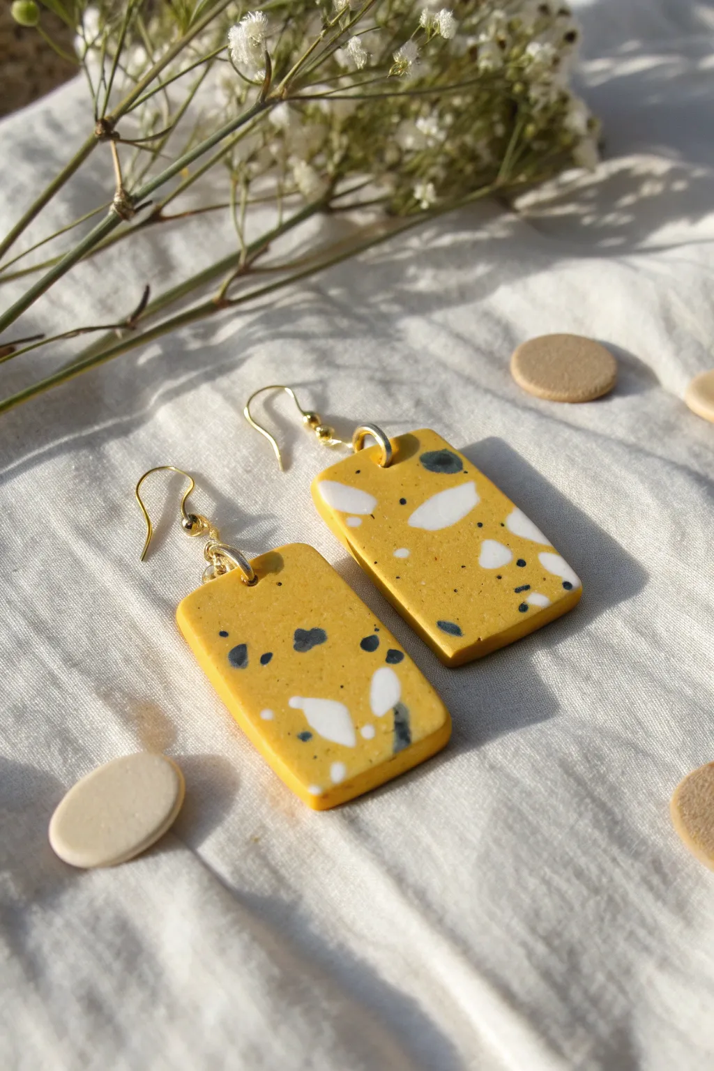 Minimal yellow terrazzo slab earrings with crisp flecks and soft linen styling, clean and handmade