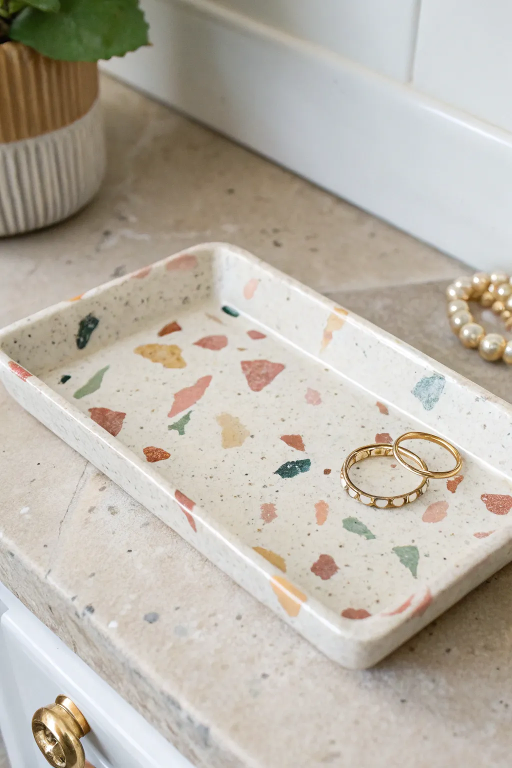Make it chic: a glossy faux terrazzo air dry clay tray to keep your everyday treasures tidy.