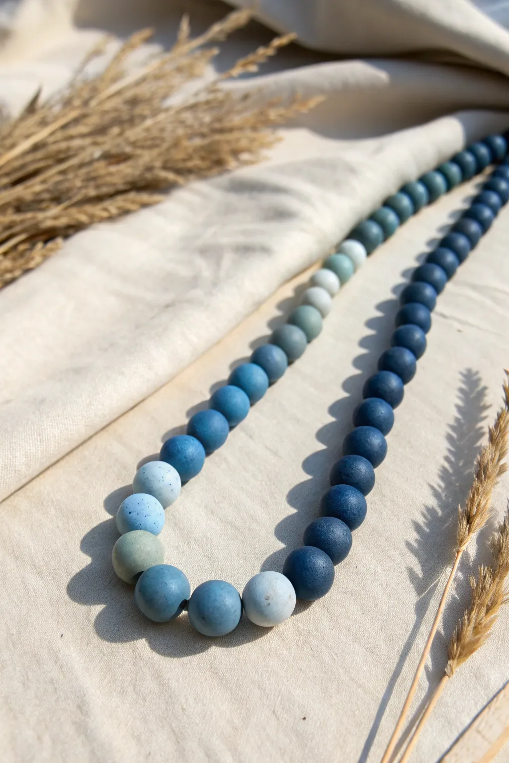 Minimal blue ombre clay beads from sky to navy, a simple Scandinavian-boho accent for jewelry.