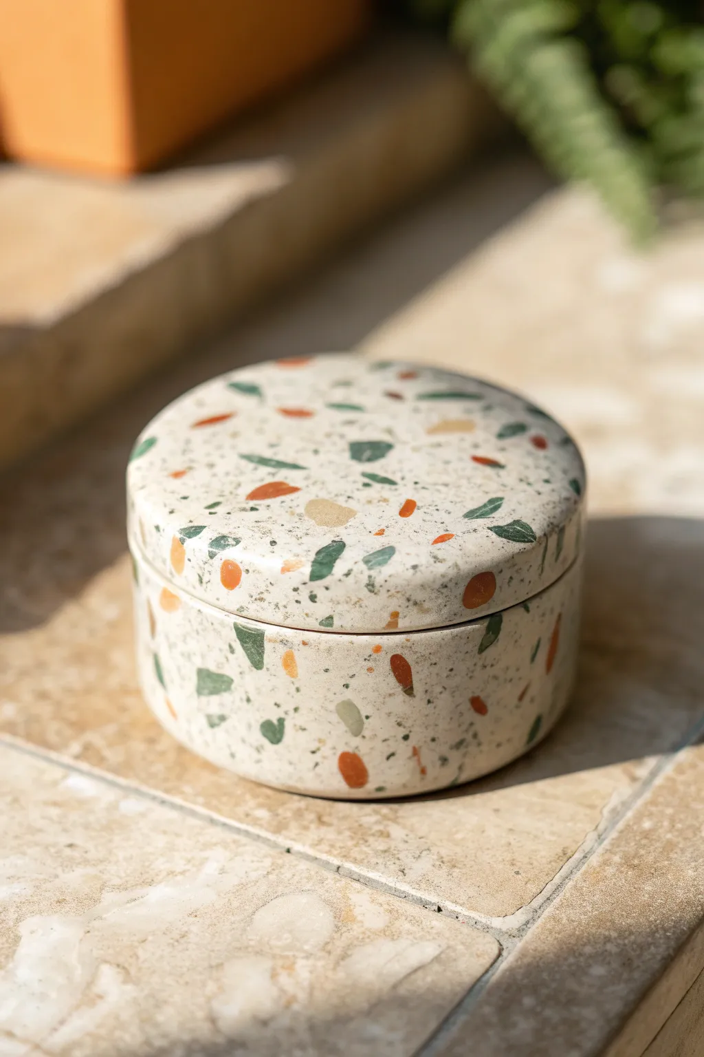 Polymer clay trinket box with a snug lid and soft terrazzo pattern for minimalist boho storage.