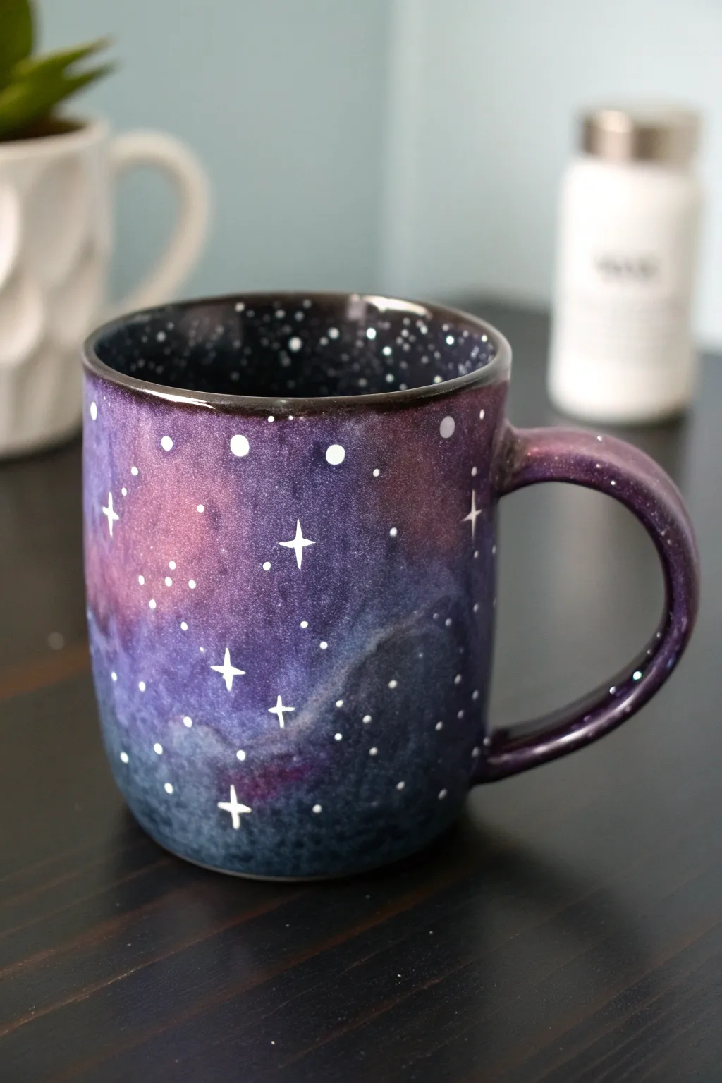 Dreamy galaxy sponge-effect mug in purples and blues with star speckles, minimalist and handmade.