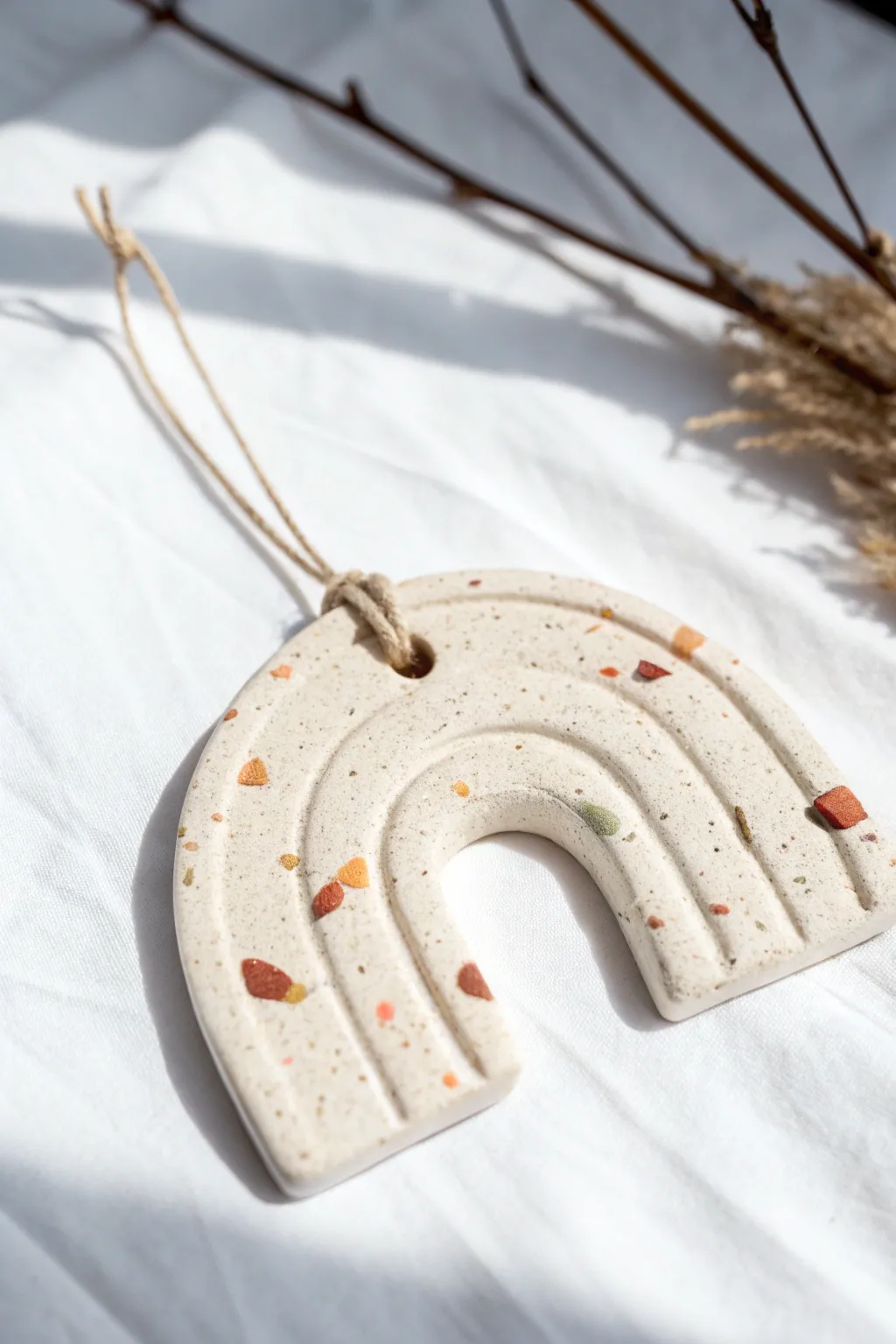 Smooth terrazzo speckle clay ornament, bright and minimal with sweet confetti pops for kids