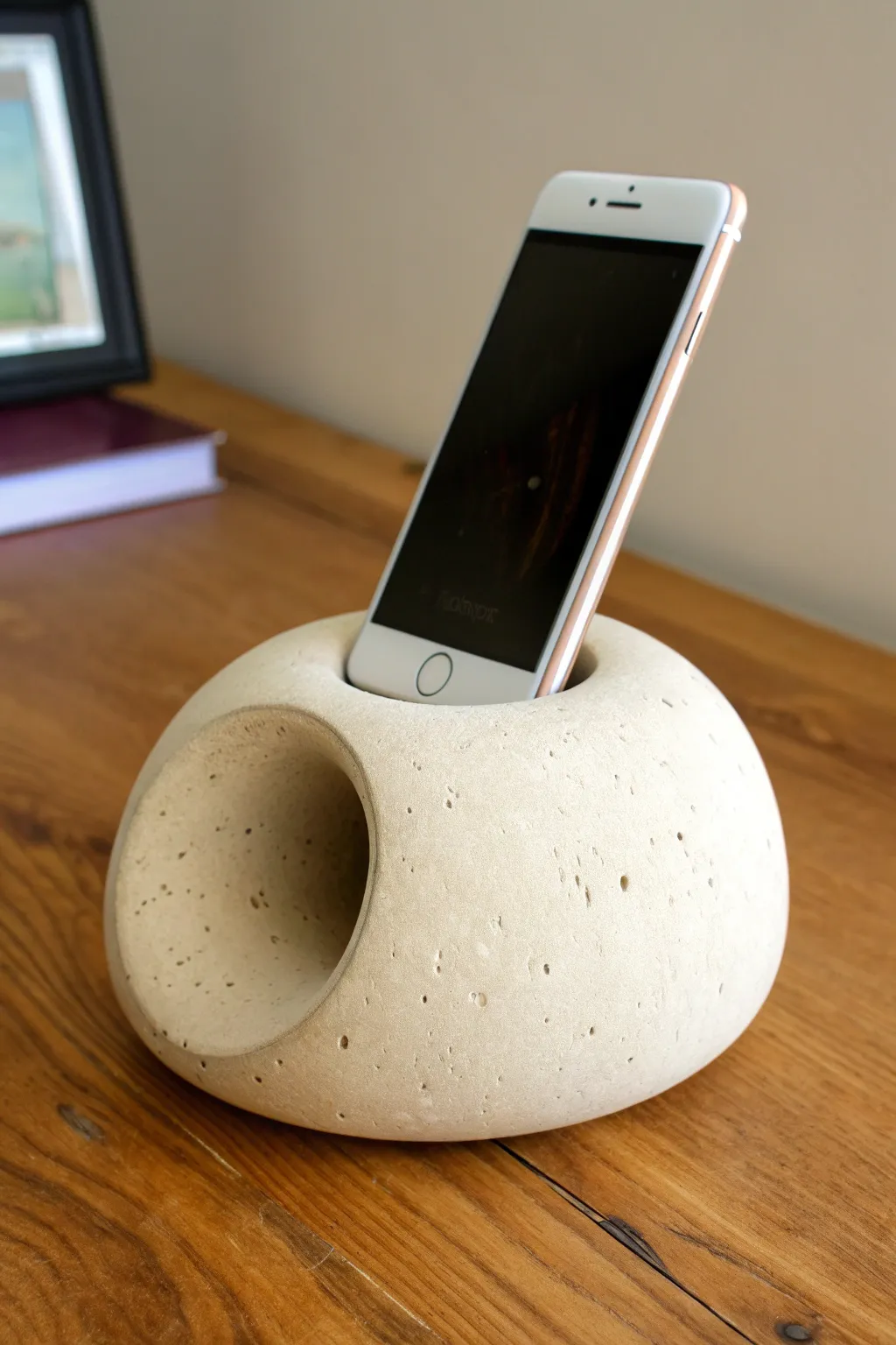 Minimal clay phone amplifier with a hidden labyrinth tunnel for warm, natural sound.