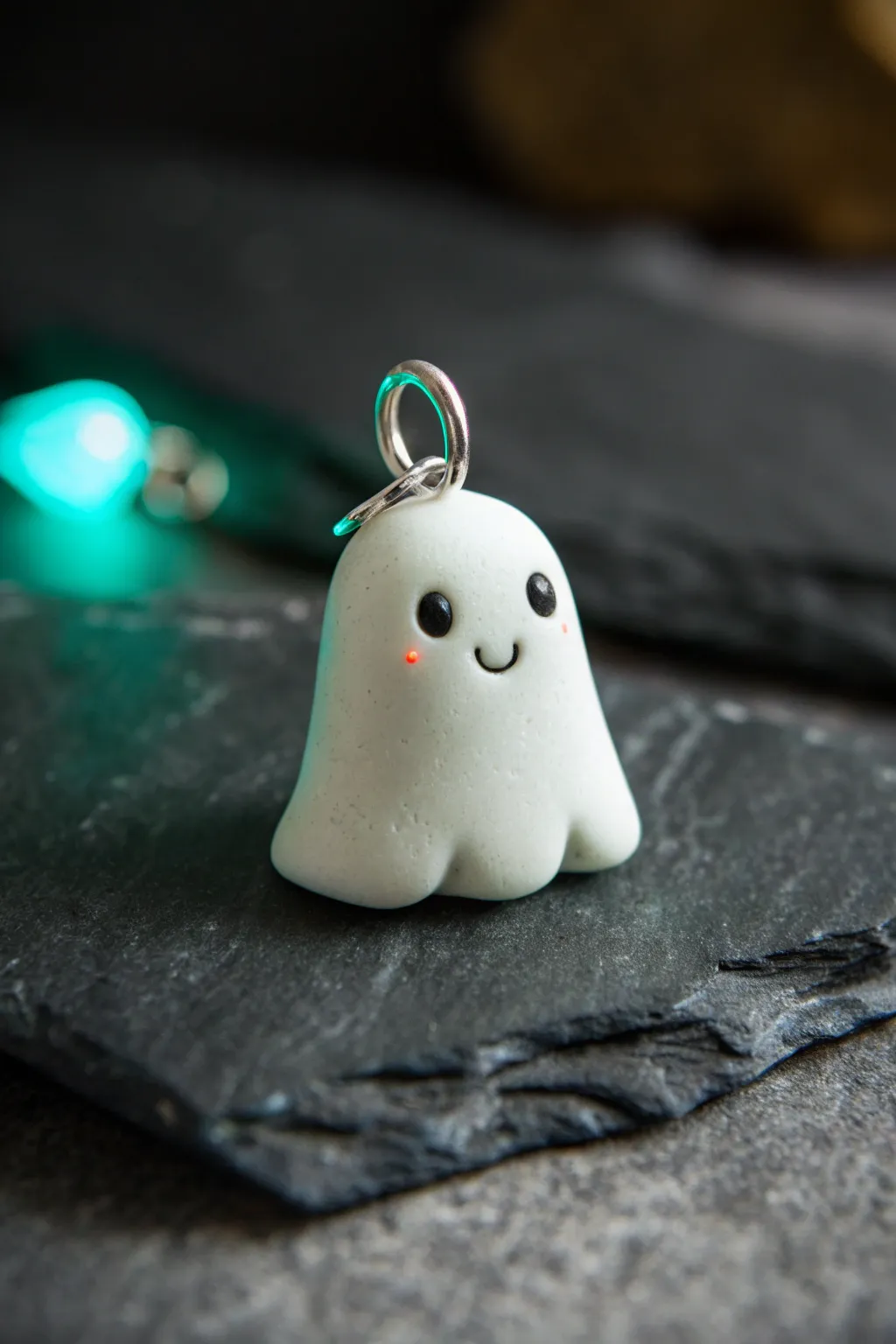 Adorable glow-in-the-dark ghost charm in minimalist styling, perfect for cute clay projects
