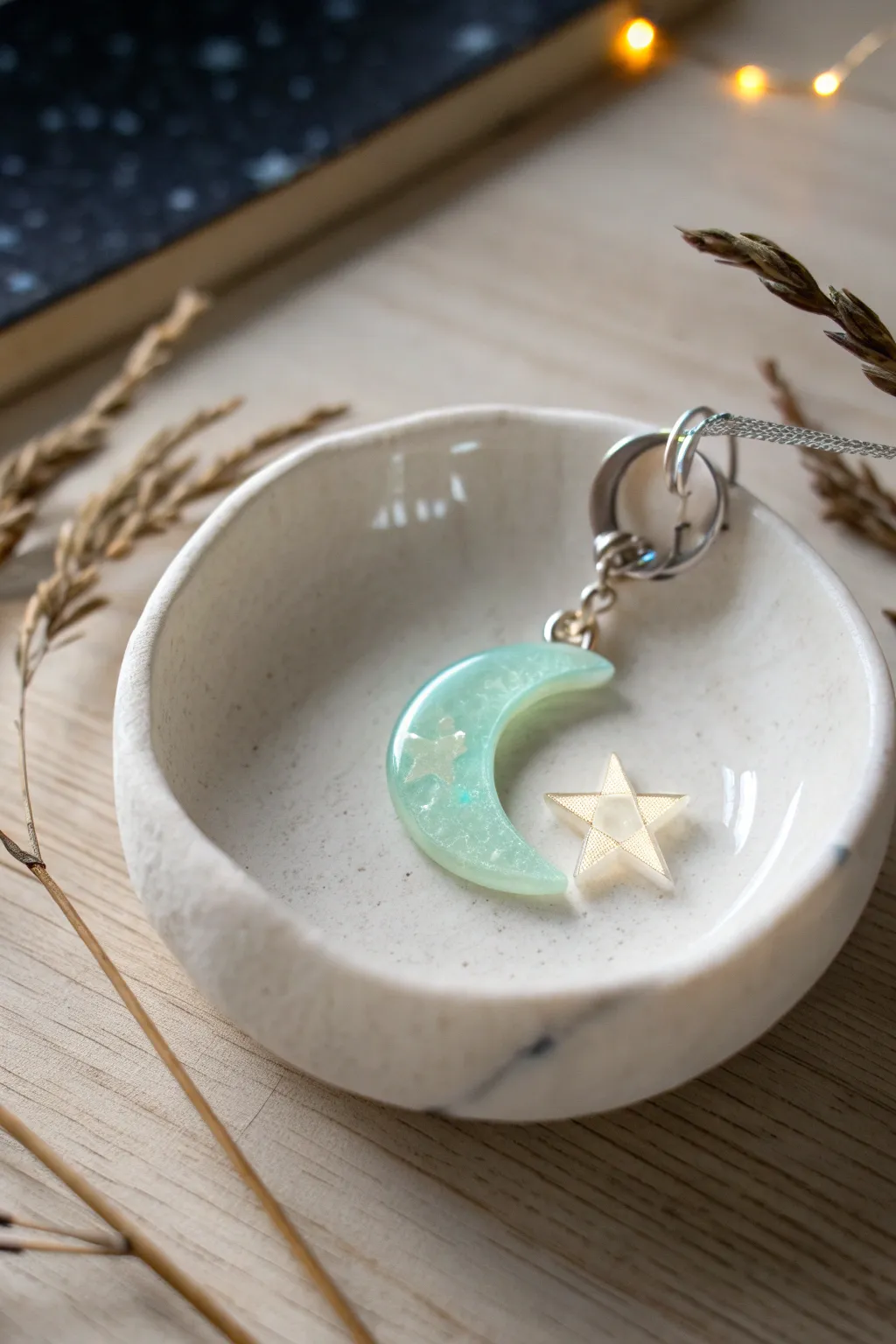 Soft-glow moon charm in liquid polymer clay, a cozy night-sky accent for your keychain.