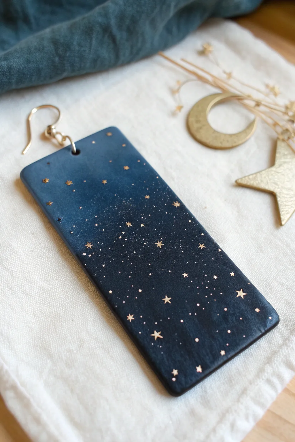 Deep navy polymer clay slab with metallic flecks and tiny stars, perfect for boho earrings.