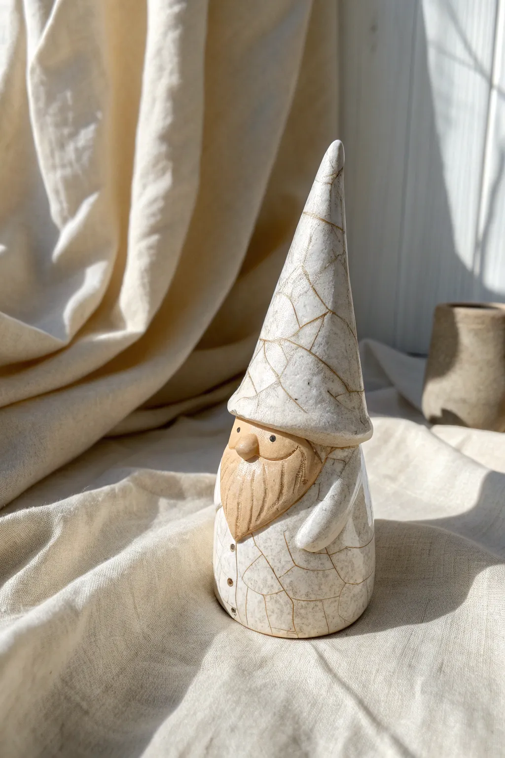 Crackle-glazed hat gnome with a calm matte body, a minimalist clay idea with boho warmth