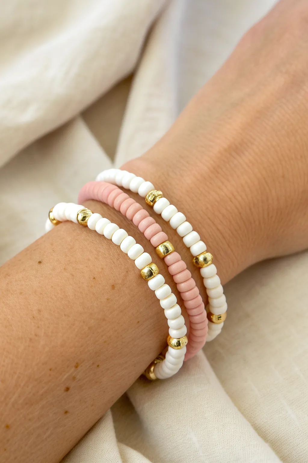 Double-strand heishi beads in white, blush, and gold for extra preppy volume and polish