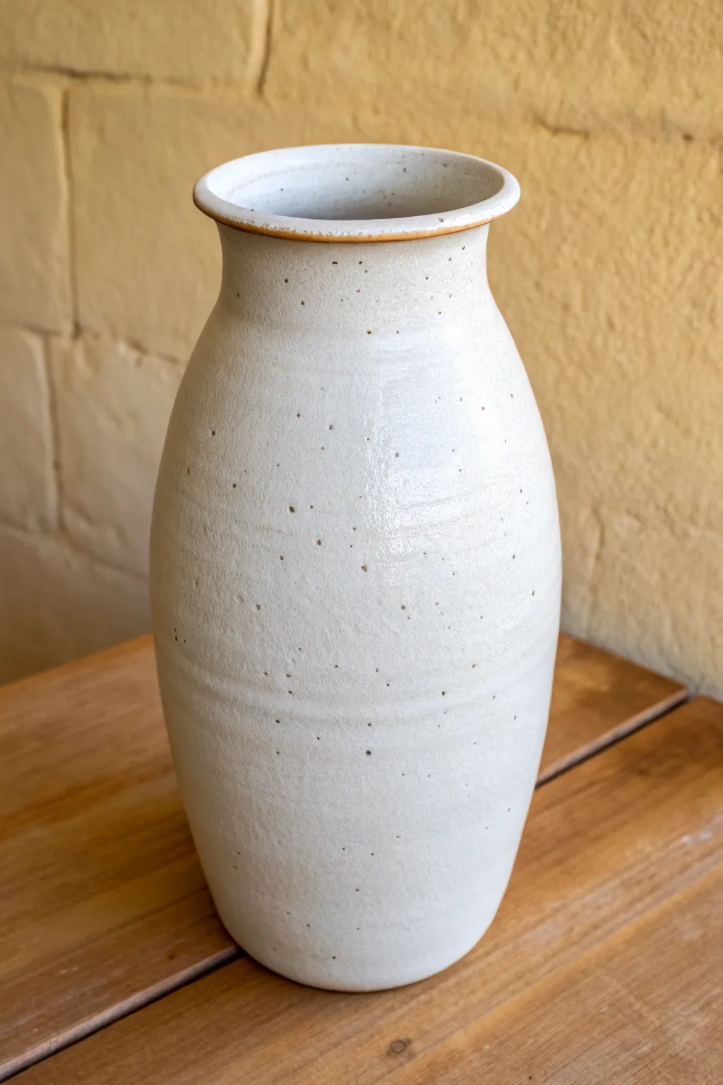Altered oval vase from a simple thrown cylinder, minimal form with handcrafted warmth.