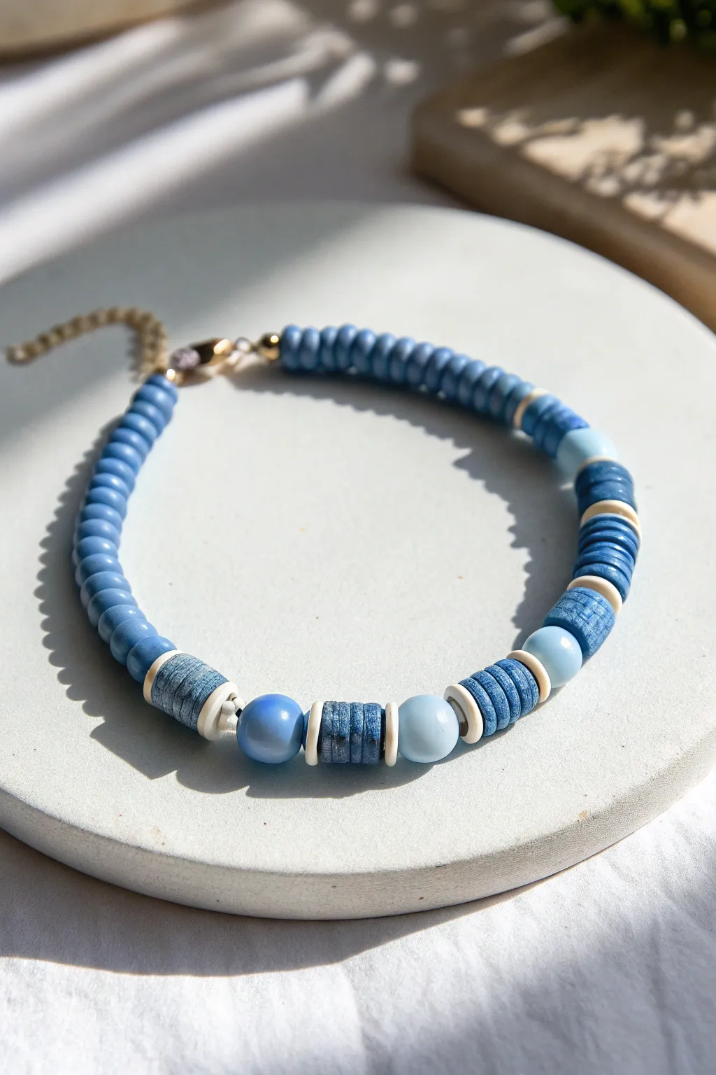 Monochrome blue clay bracelet with mixed bead shapes for a simple, modern boho look