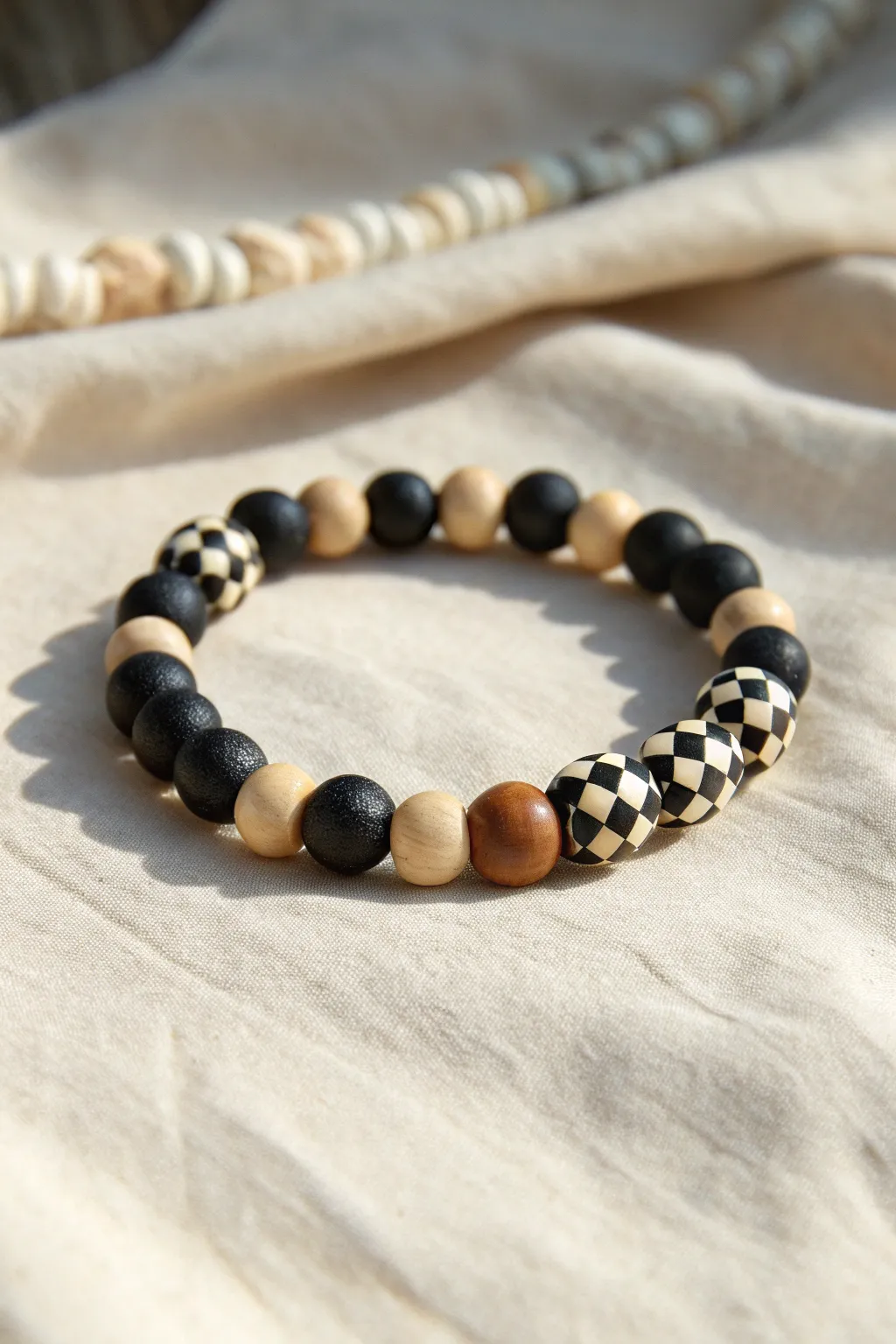 Classic checkerboard clay bead bracelet with minimalist contrast and simple spacer details.