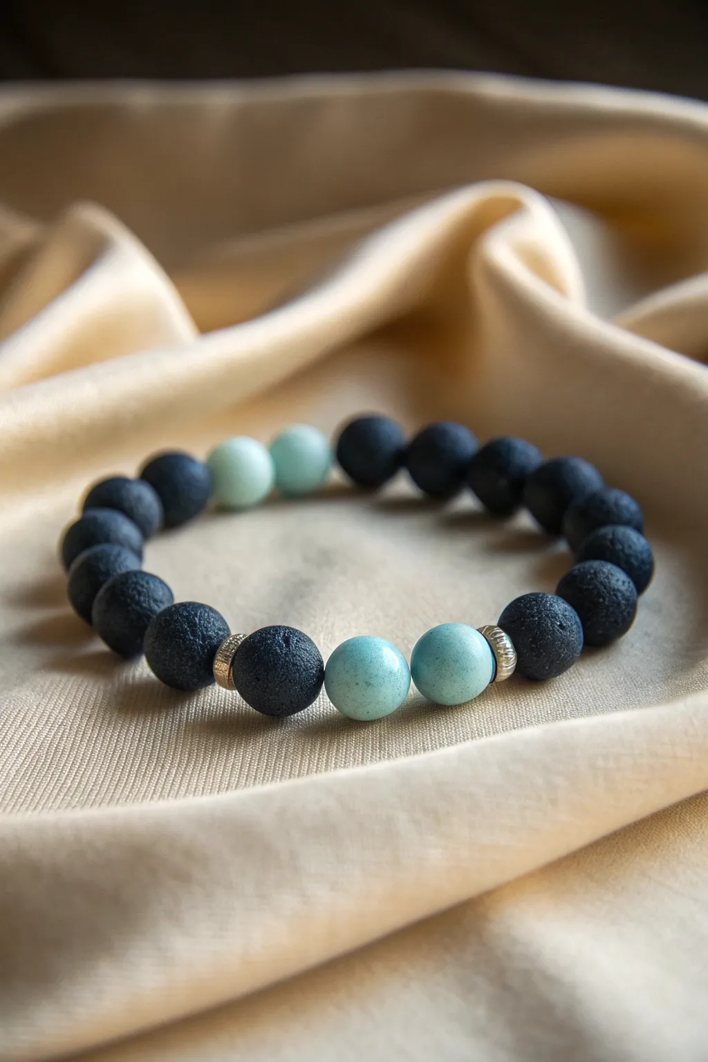 Dark navy ocean clay beads with soft glow accents for a dreamy bioluminescent night-sea look