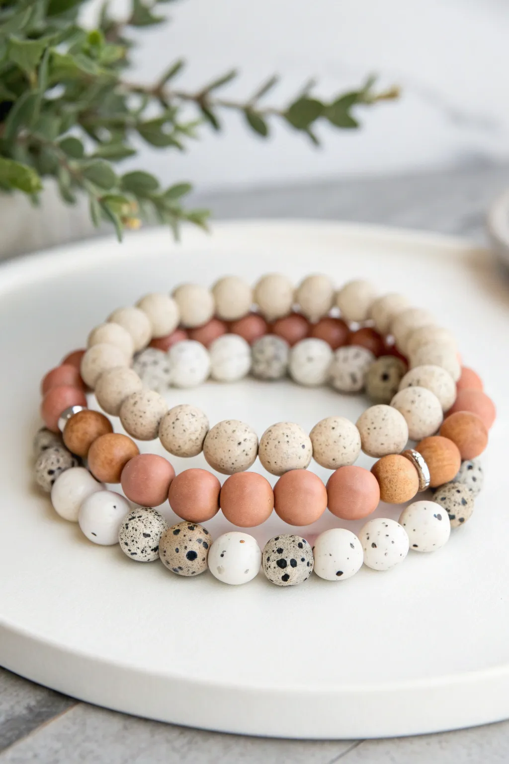 Marble and terrazzo clay bead bracelet stack in soft neutrals, crisp minimal styling