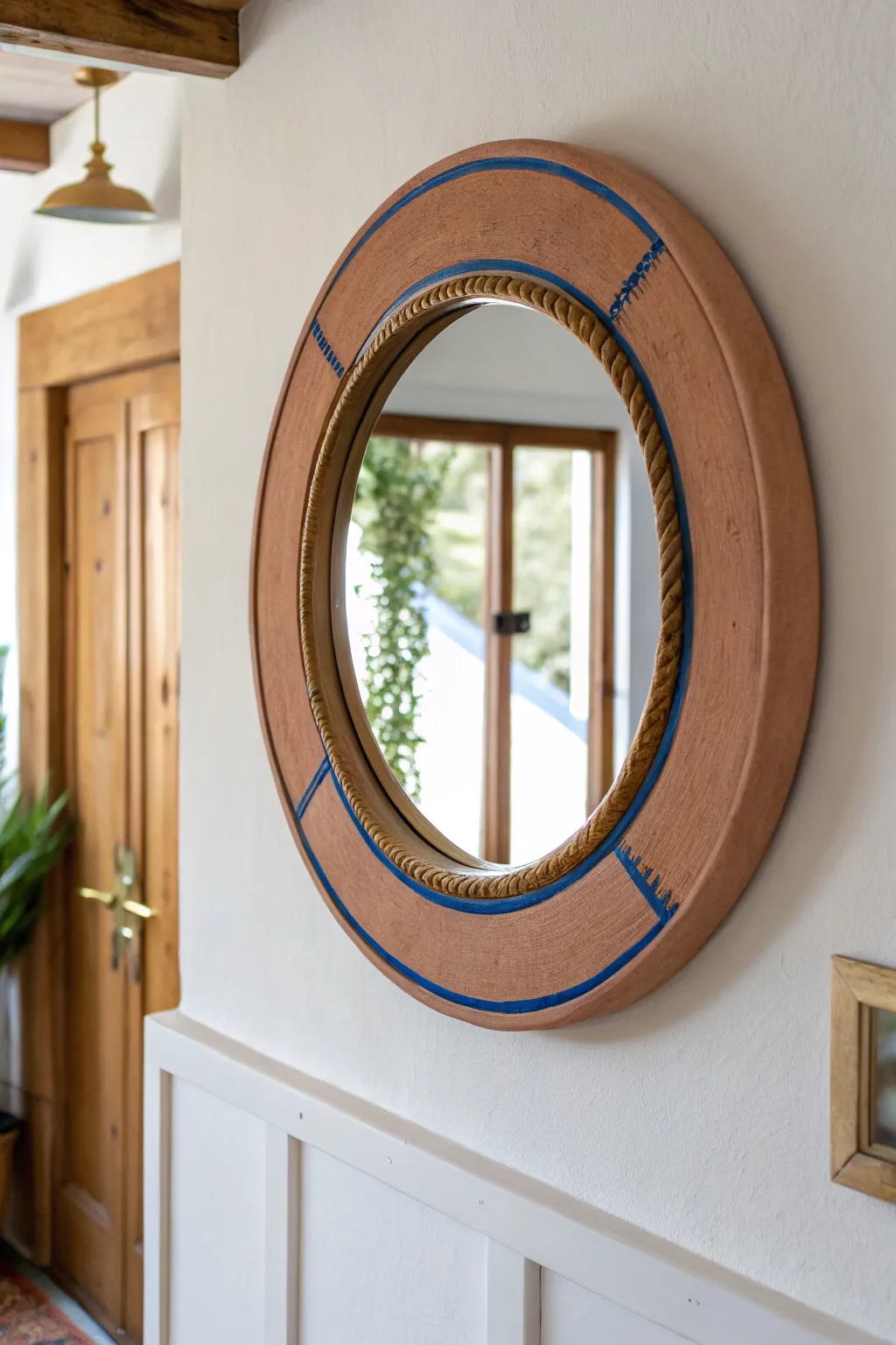 Minimal clay texture meets brass shine, a bold round mirror frame you can make at home.