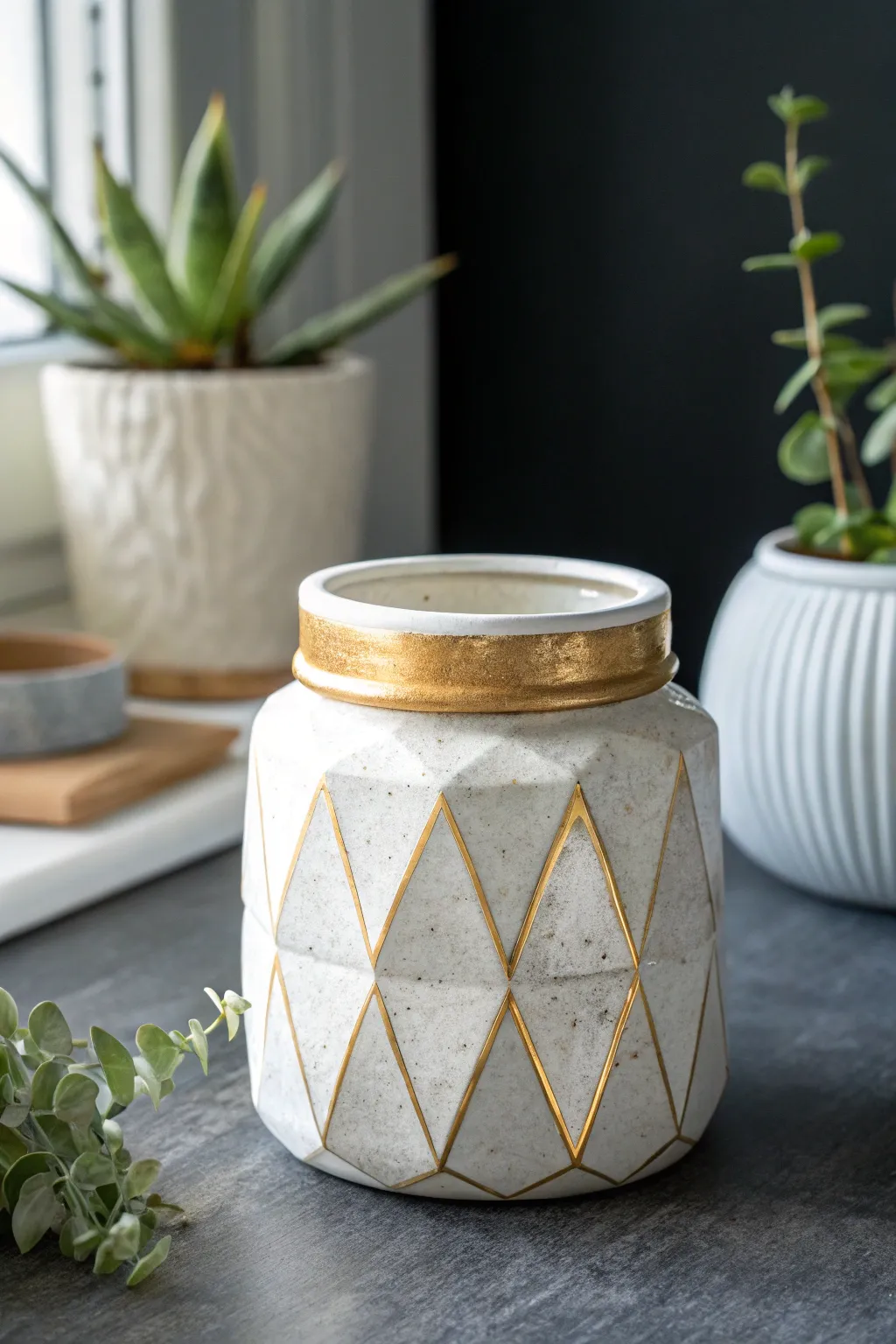 Bright white geode facet clay jar with subtle gold edges, a bold minimalist boho accent