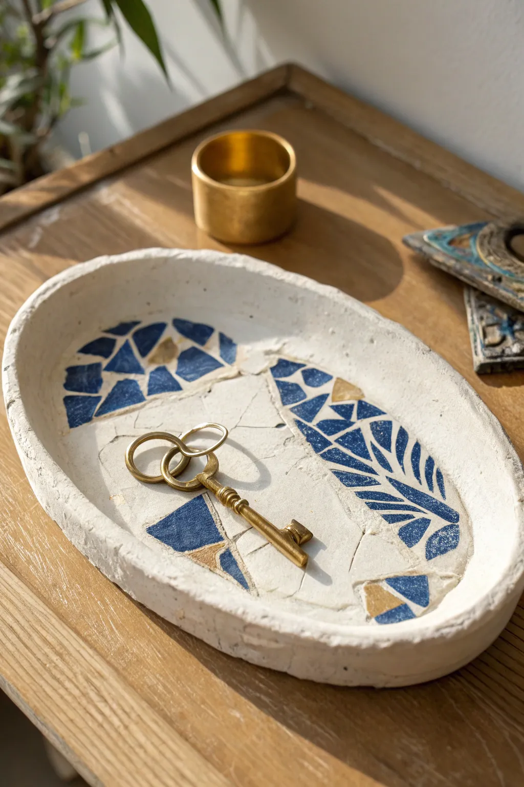 Air-dry clay tray with embedded china shards, a chic mosaic catchall for rings and keys.