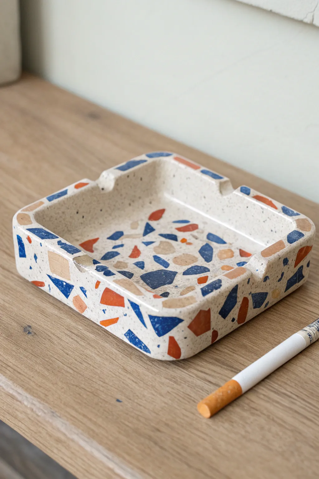 Terrazzo tile look ceramic ashtray with hidden notch rests, minimalist Scandinavian with boho color pop.