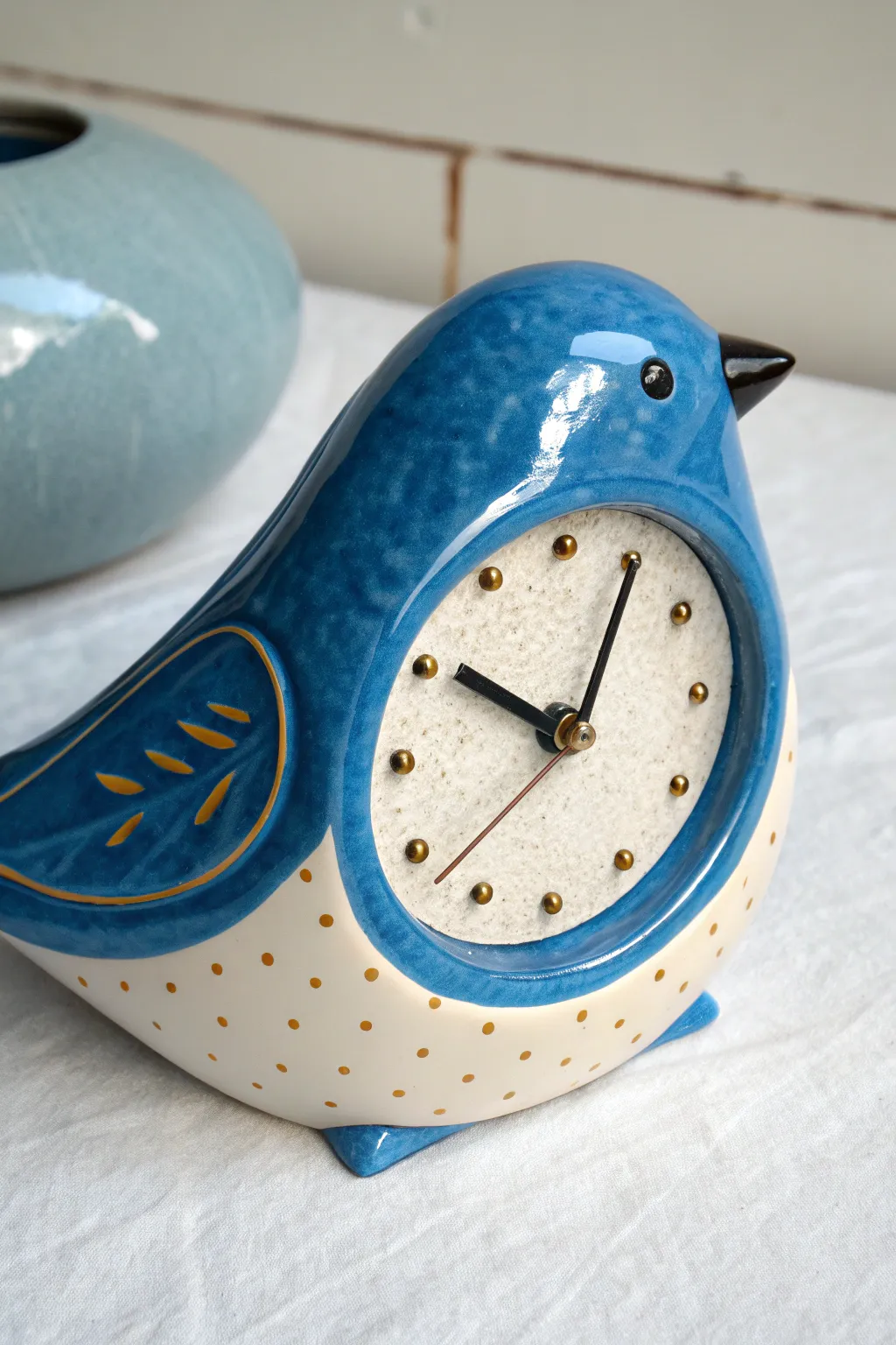 Playful animal-shaped ceramic table clock with bright glaze and raised dots, minimalist charm.