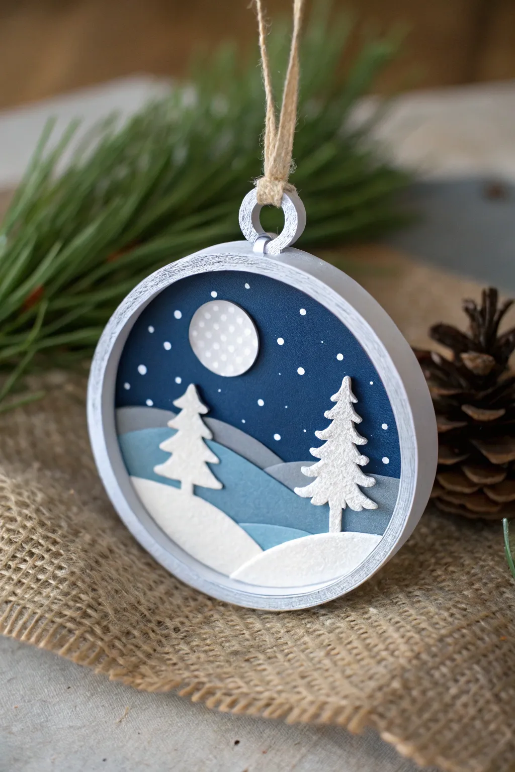 Minimal layered clay shadowbox ornament scene with warm lights for an easy wow Christmas DIY