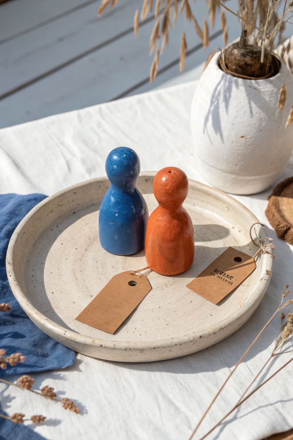 Blindfold swap fun: two quirky mini sculptures side by side, imperfectly charming and bold