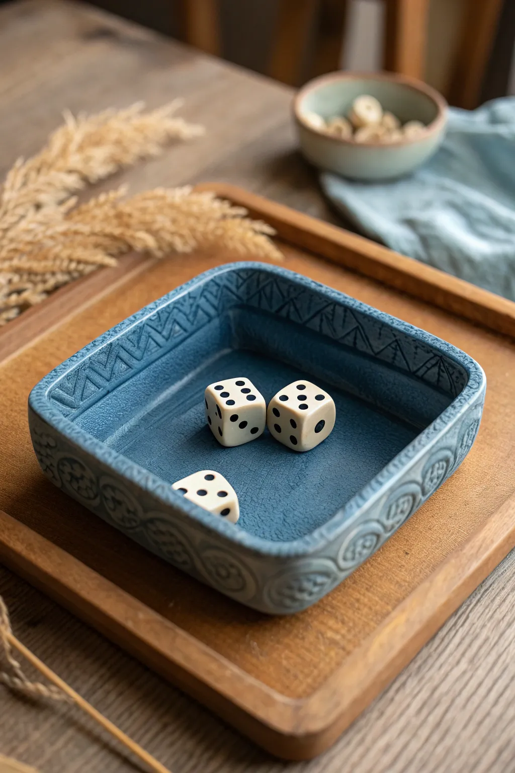 Minimalist clay dice tray with bold geometric texture, cozy game-night glow, and boho warmth.