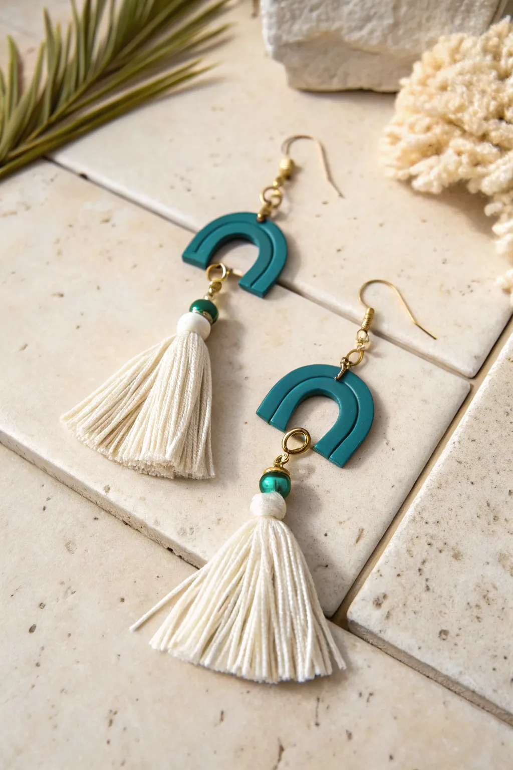 Minimal teal polymer clay tops with soft cream tassels for an easy mixed material statement