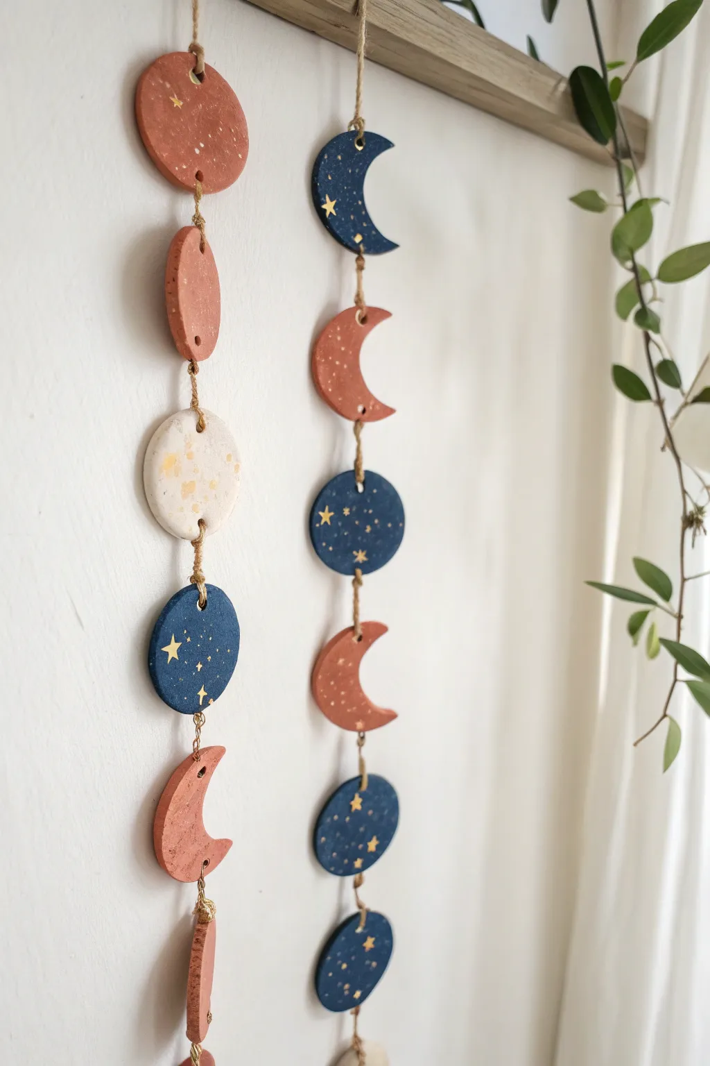 DIY moon phase garland in polymer clay with subtle metallic accents for a calm boho vibe