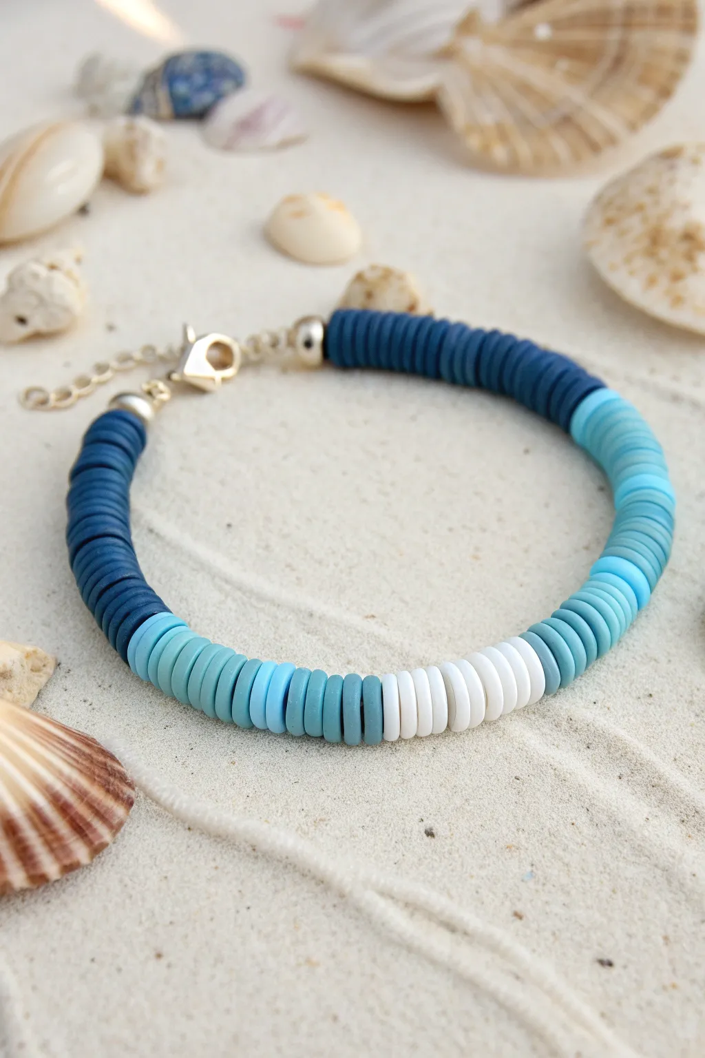 Ocean ombre heishi bracelet in blues from navy to aqua, minimal beachy styling and glow.