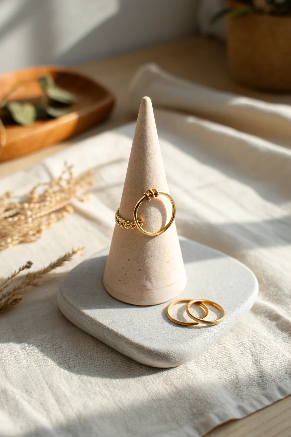 Minimal clay ring cone in blush tones, softly lit by window light for a clean boho feel.