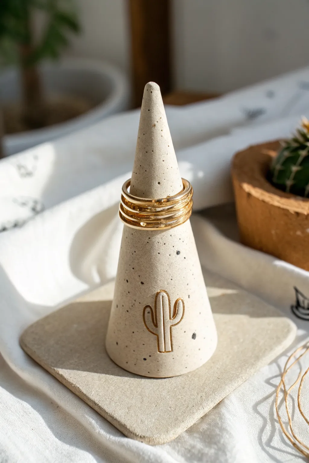 Minimal air-dry clay ring cone holder in warm neutrals, a simple handmade gift idea