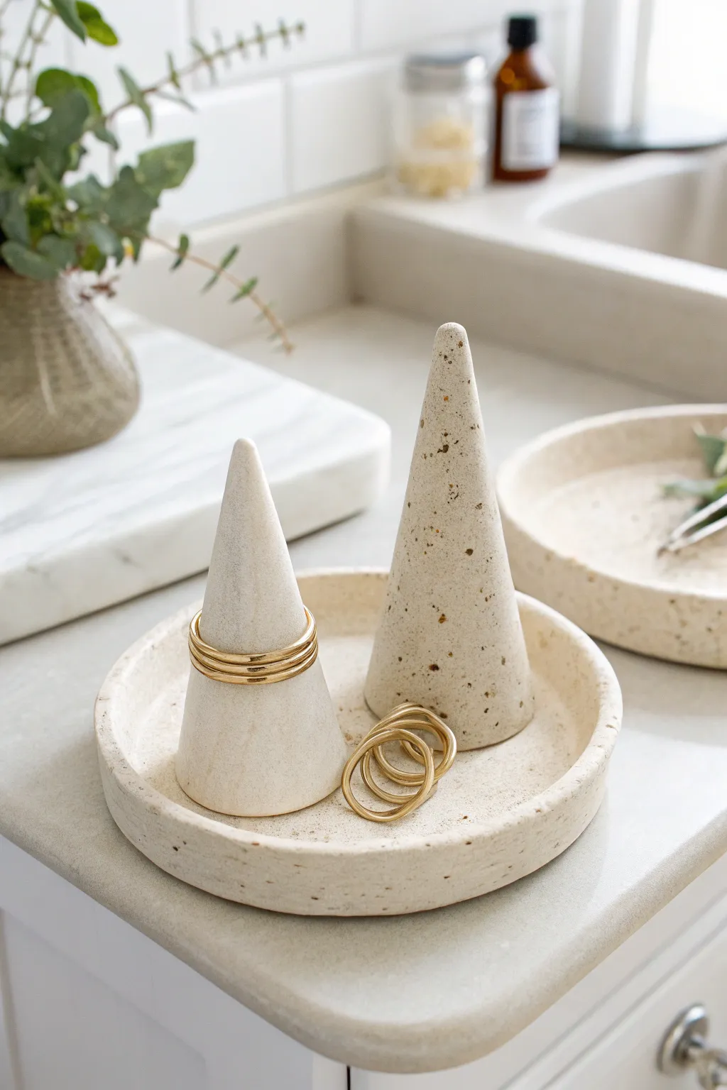 Minimal air-dry clay ring cones styled on a serene vanity tray with soft spa-like shadows