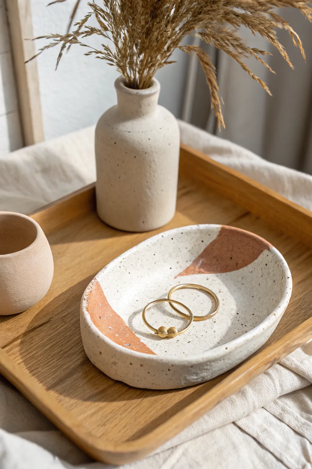 Easy air-dry clay trinket dish idea: minimal, speckled, and perfect for keeping earrings tidy.
