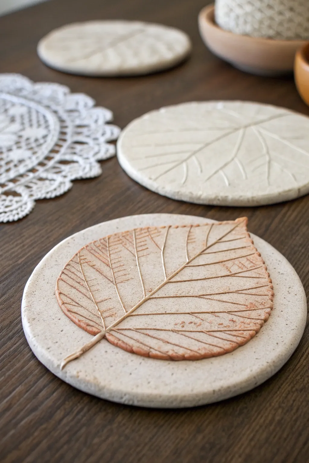 Pressed textures and earthy washes make these air dry clay coasters feel warm and handmade.