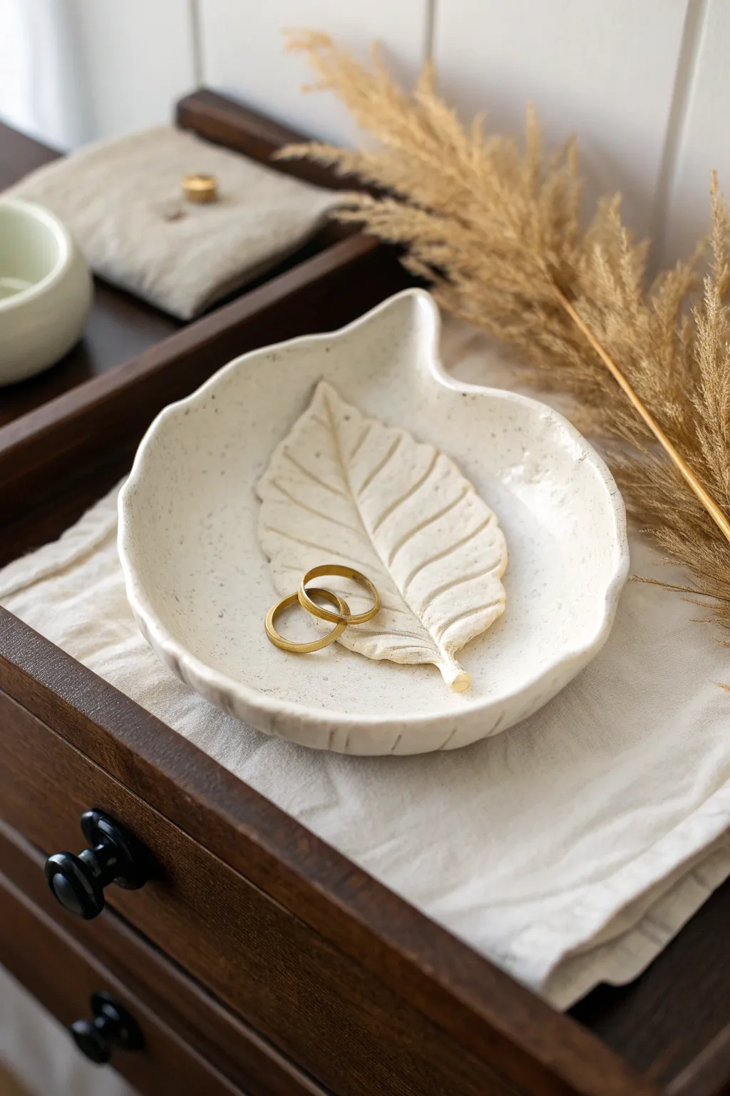 Handmade air dry clay trinket dish keeps rings and keys tidy in minimalist style.